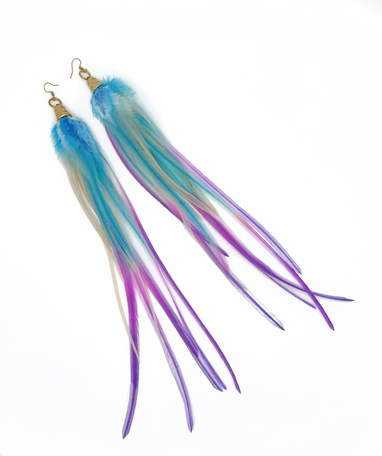 Long feather earrings in white, purple and blue.