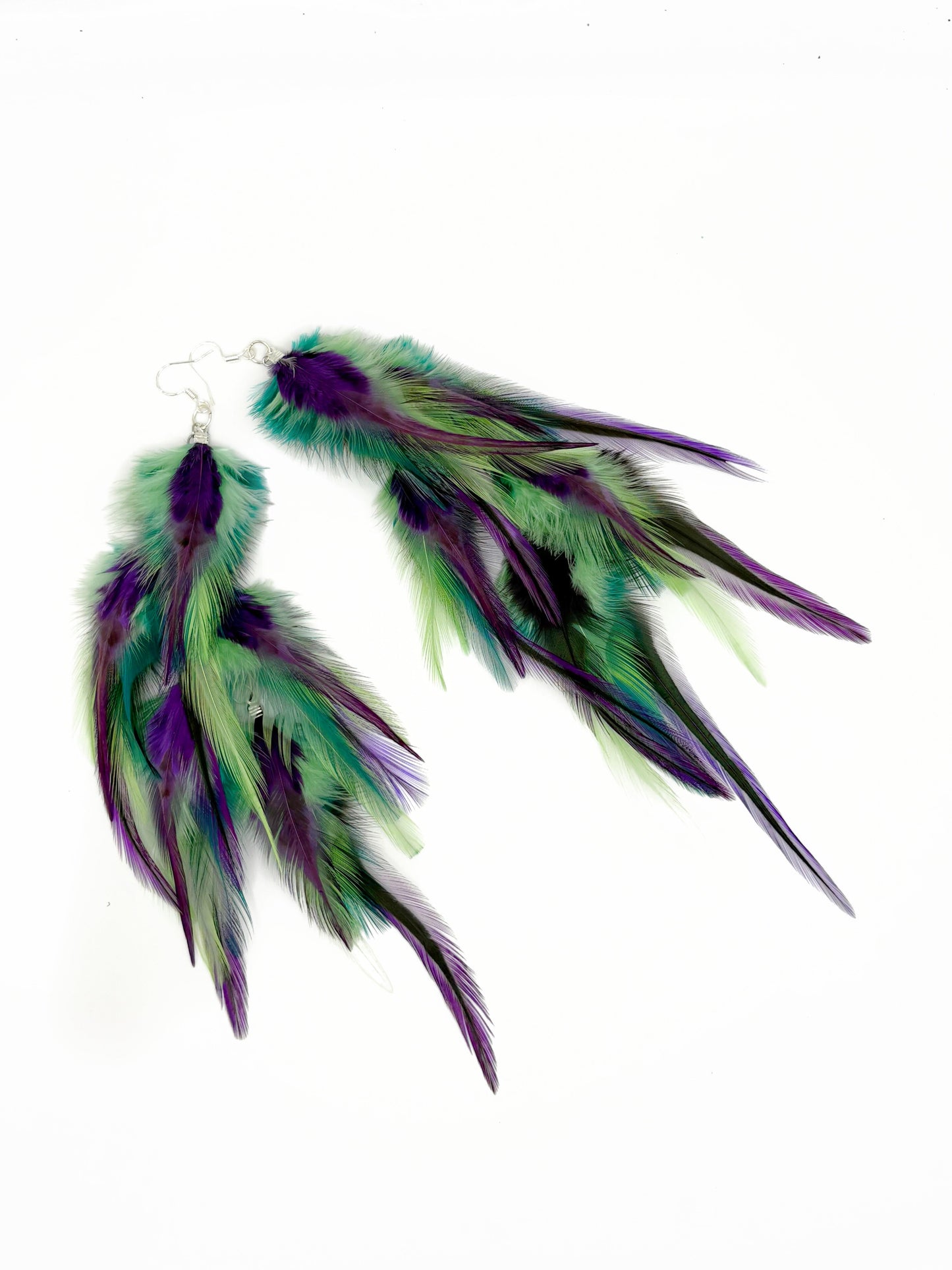 Long green and purple feather earrings.