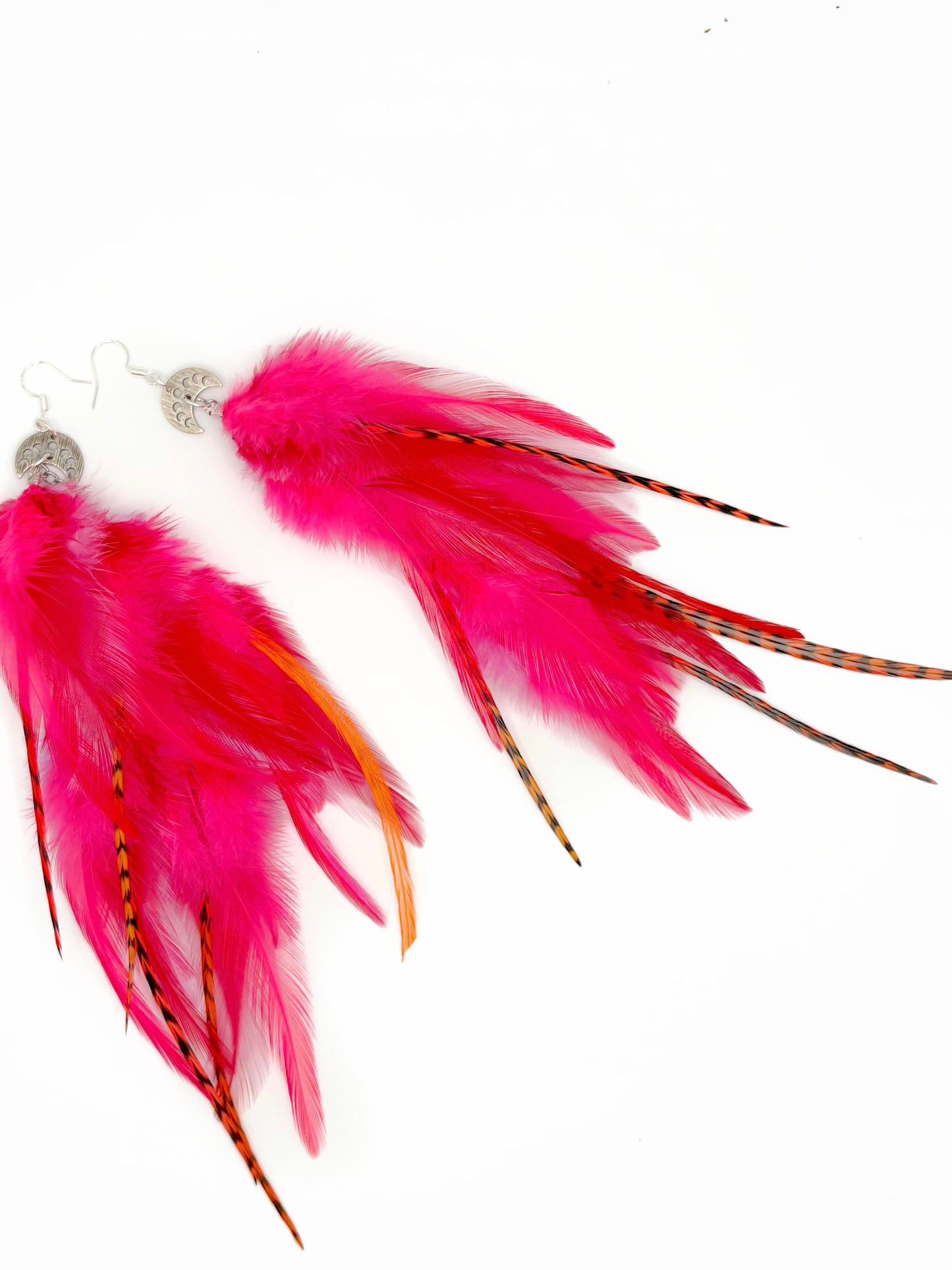 Neon pink feather earrings.