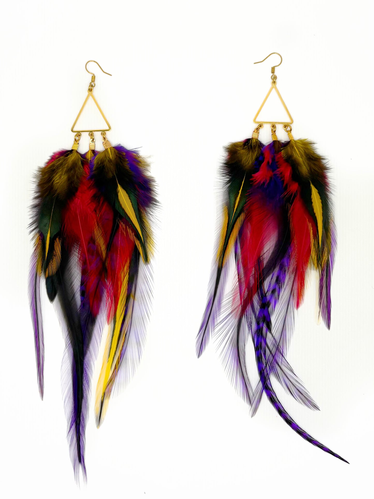 Colorful feather earrings on a white background