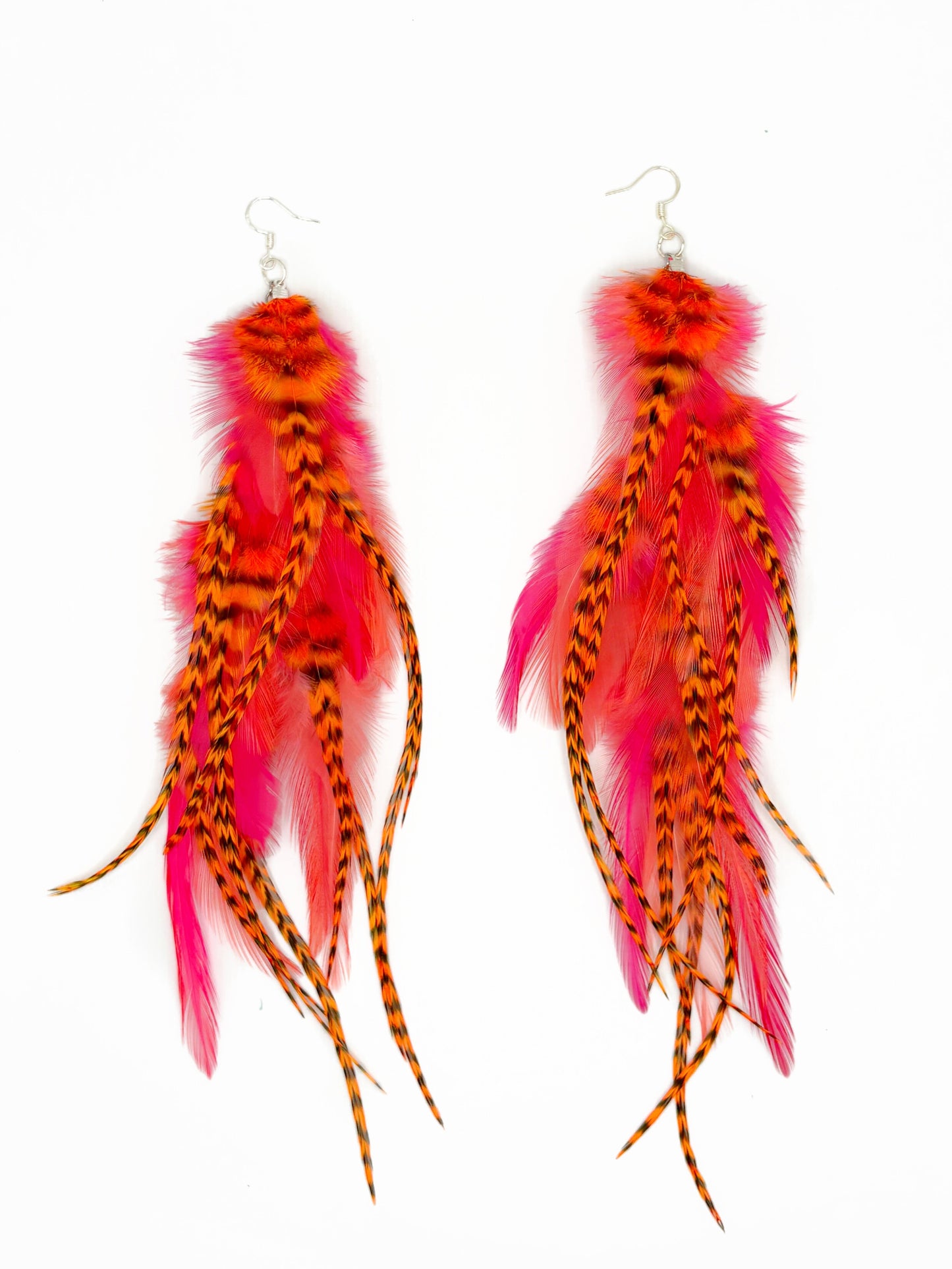 Neon pink and orange feather earrings.