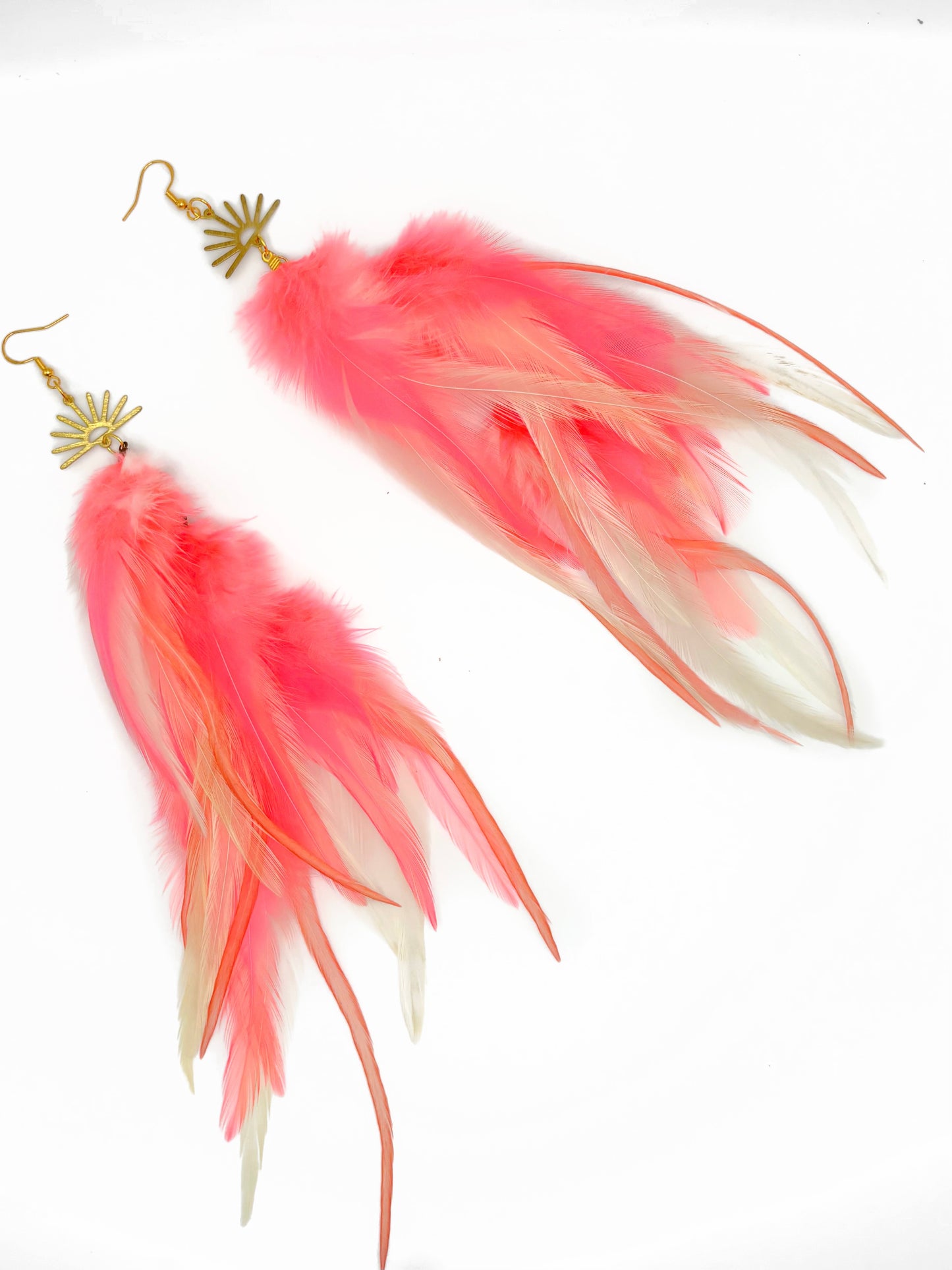 Long pink feather earrings.