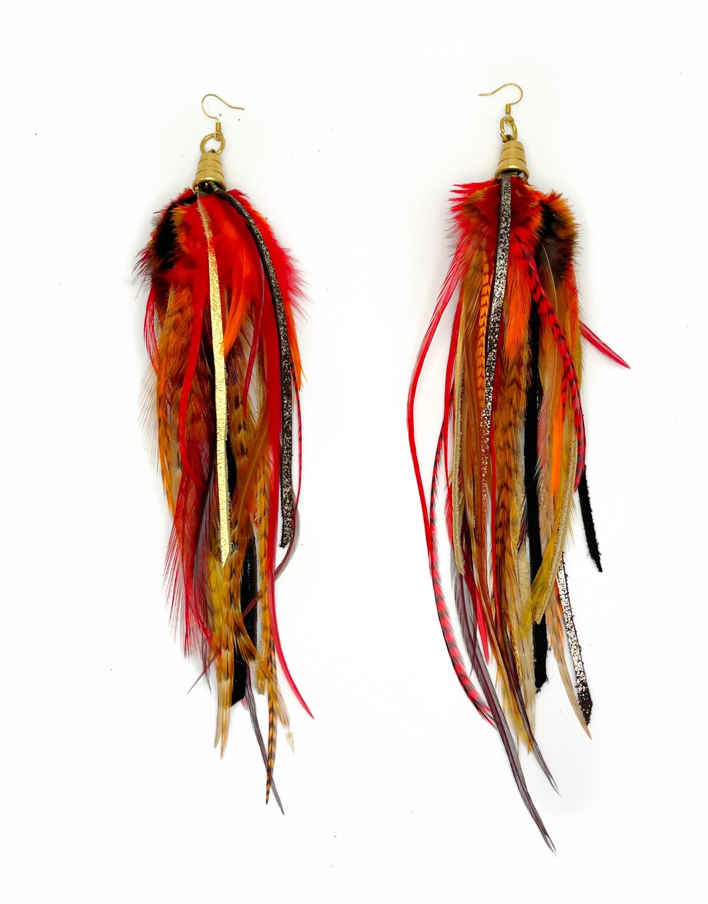 Long orange and red feather earrings with metallic gold and brown leather.