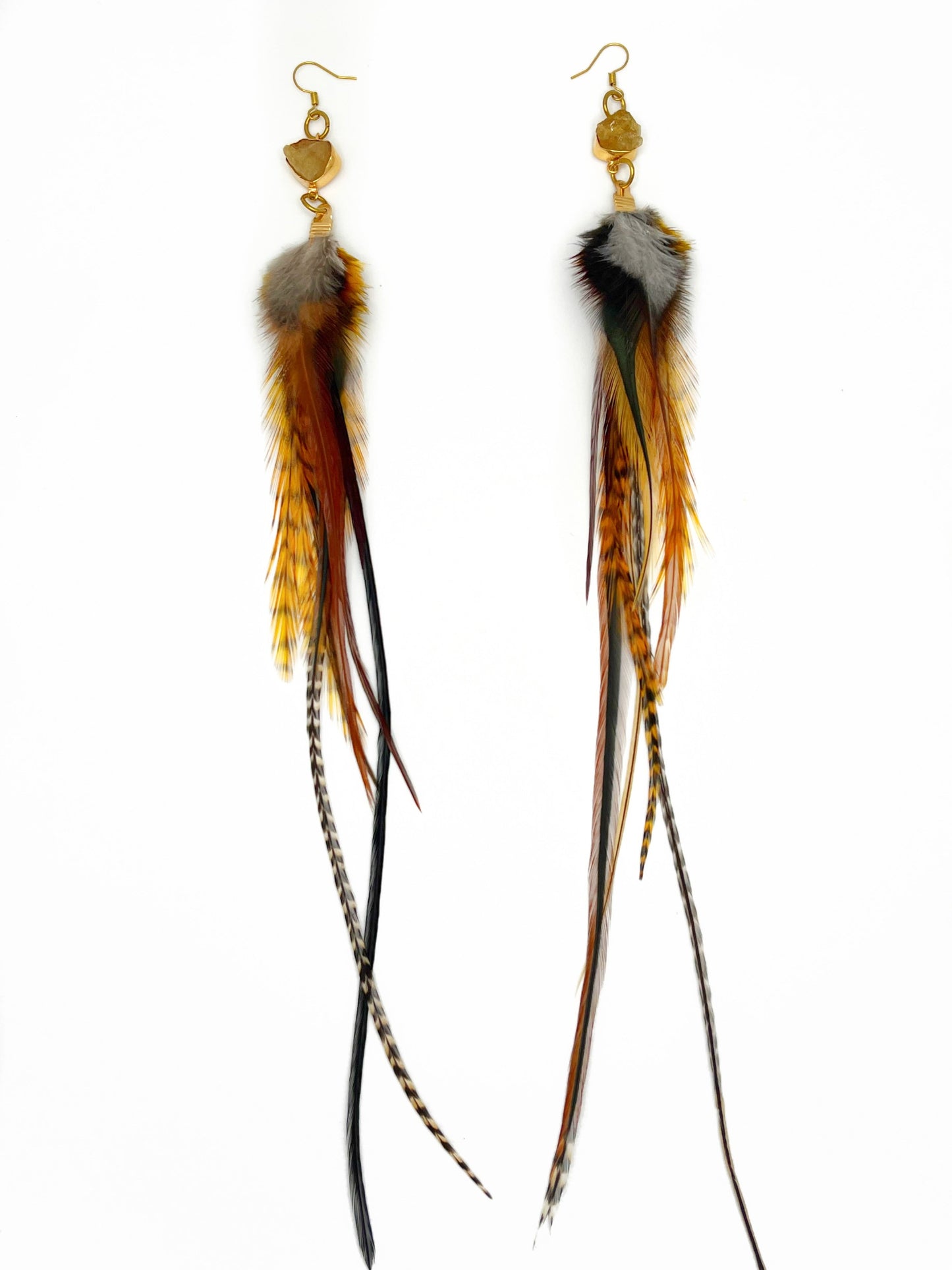 Long brown and orange feather earrings with gold citrine gemstone pendants.