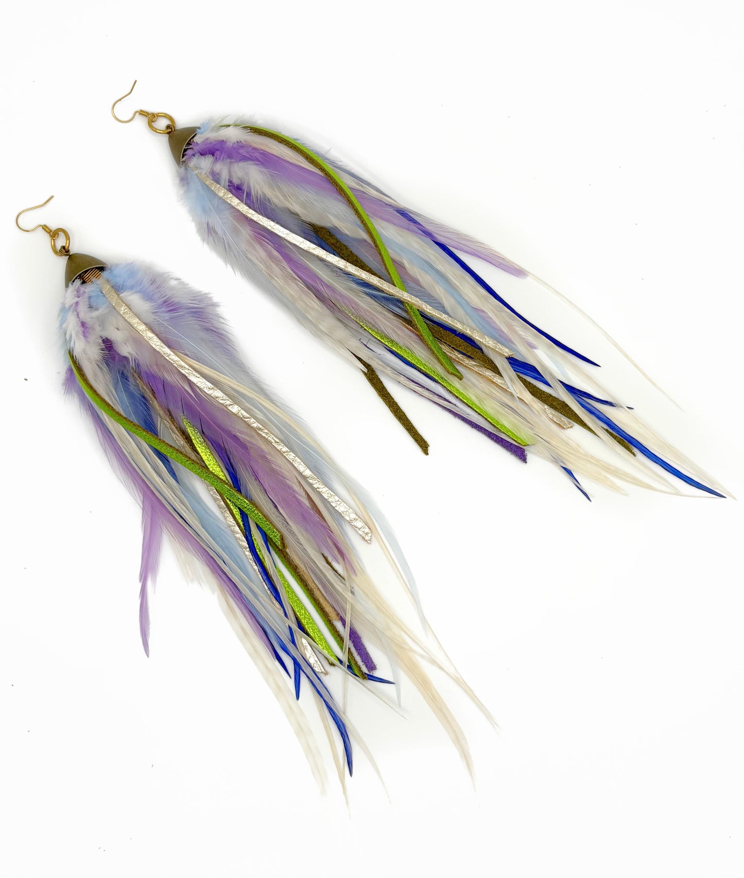 Long feather and leather earrings in cream, purple and green tones.