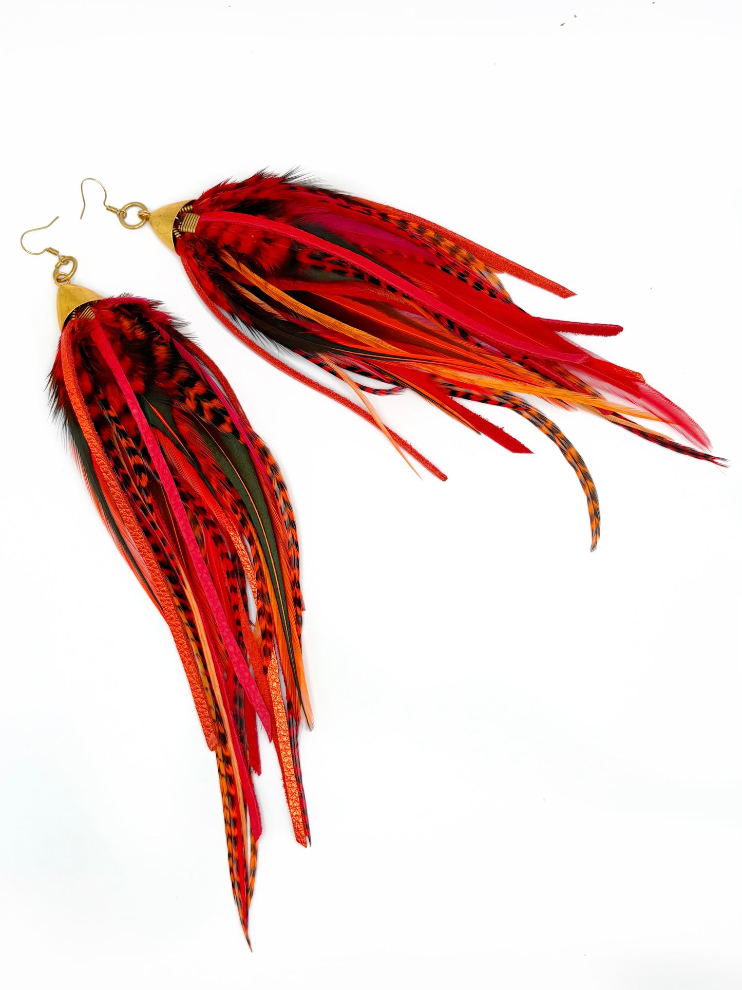 Long red feather earrings.