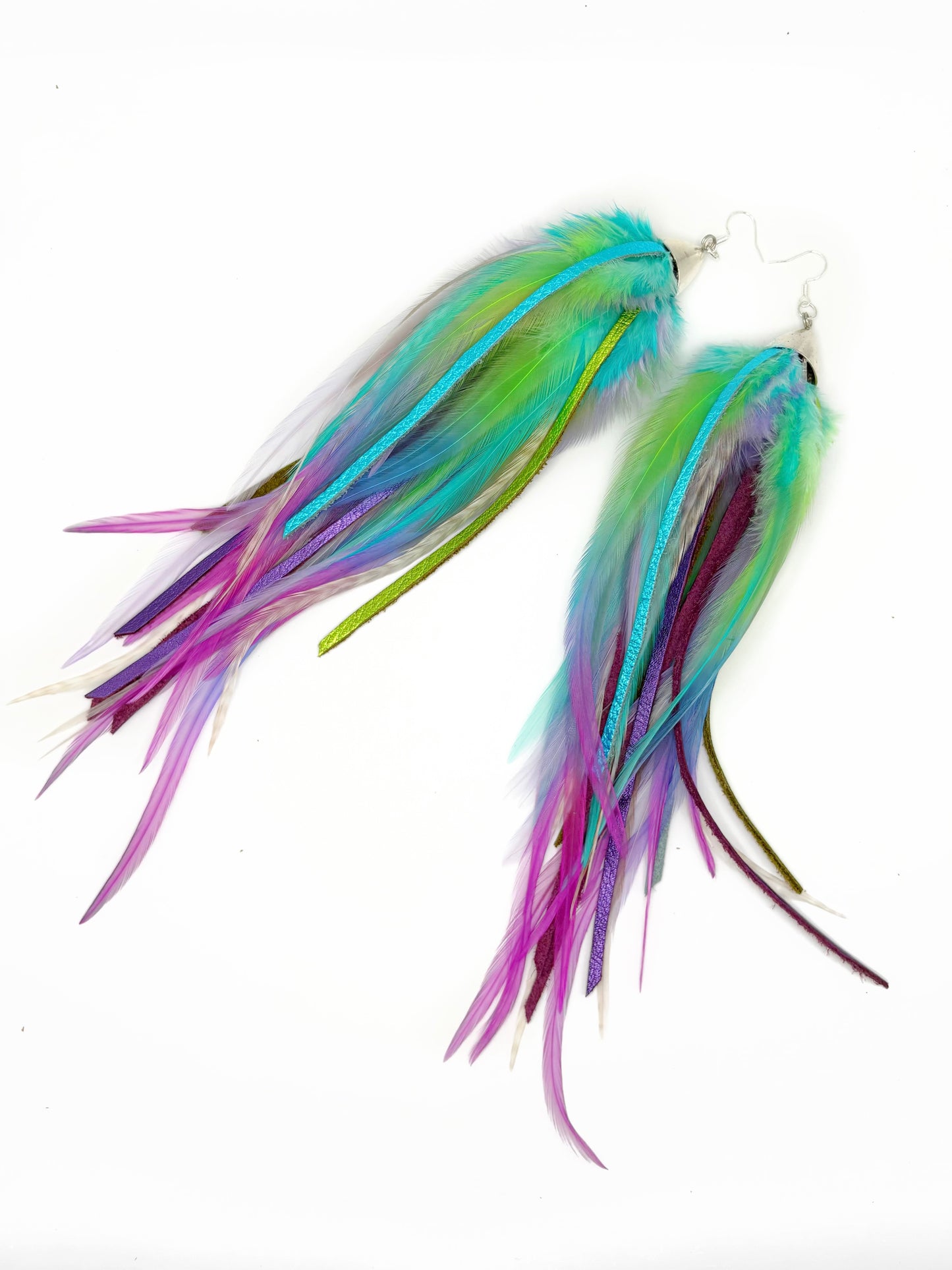 Long feather and leather earrings in blue, green and purple.