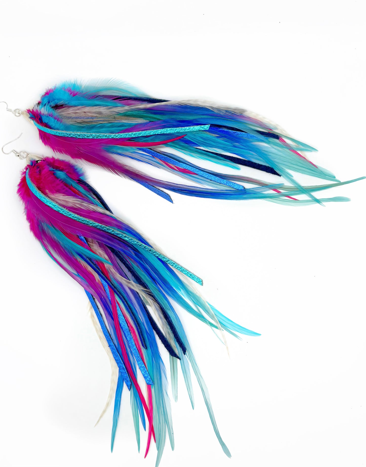Long pink and blue feather and leather earrings.