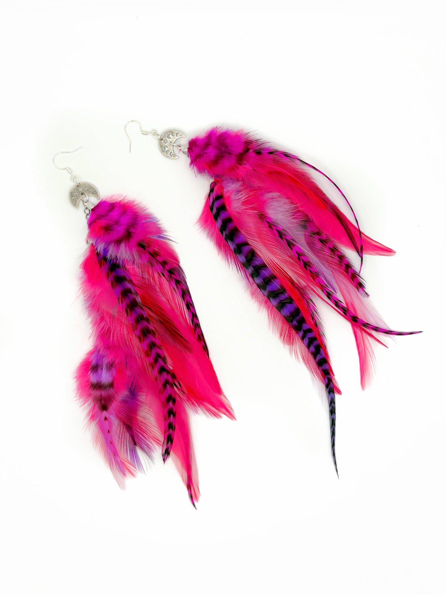 Bright pink and purple feather earrings.