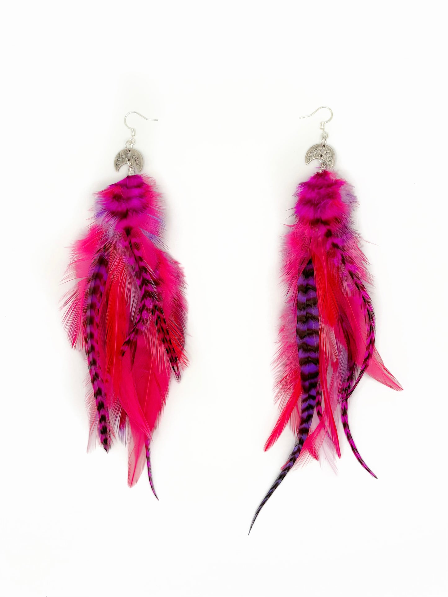 Bright pink and purple feather earrings.