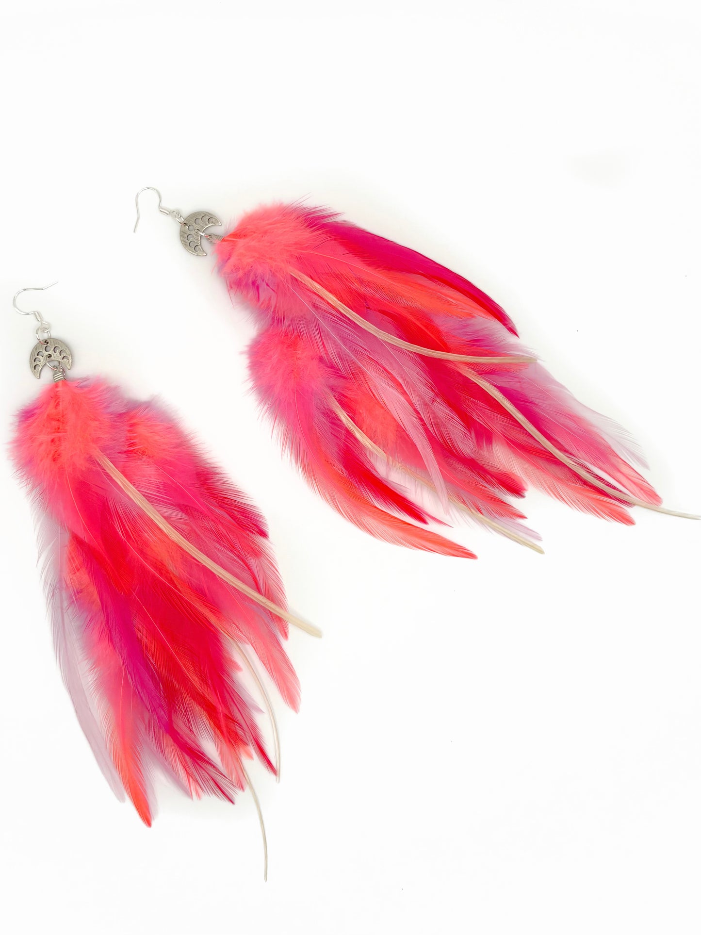 Neon pink feather earrings.