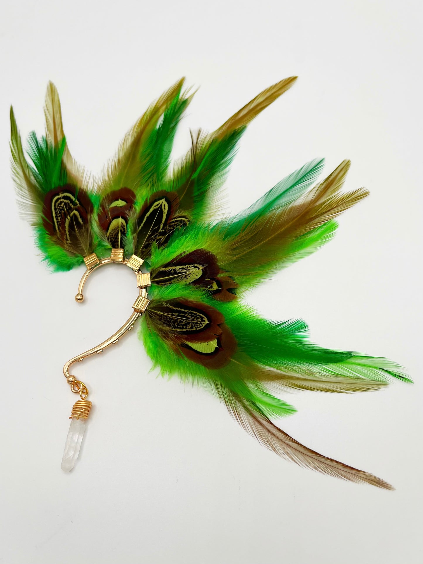 Vibrant green rooster and pheasant feather ear cuff with a wire wrapped quartz stone that hangs from the bottom of the cuff.