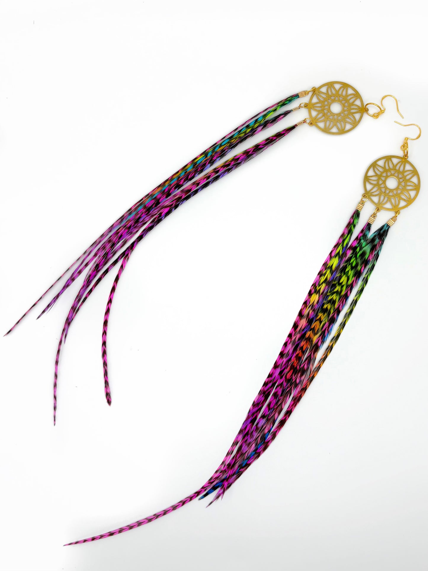 Colorful feathered hair tie with gold dreamcatcher design on a white background