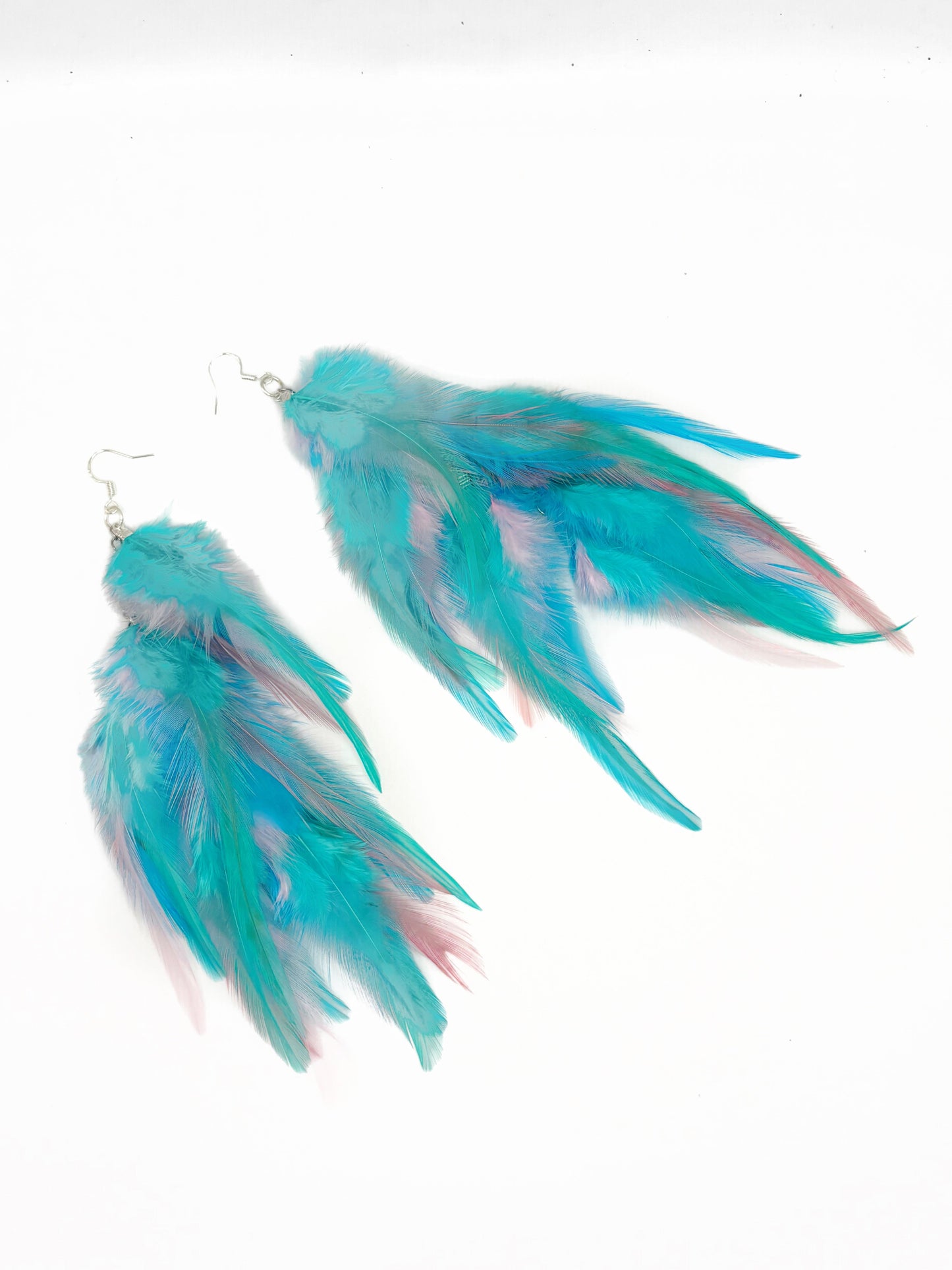 Long fluffy feather earrings in light blue.