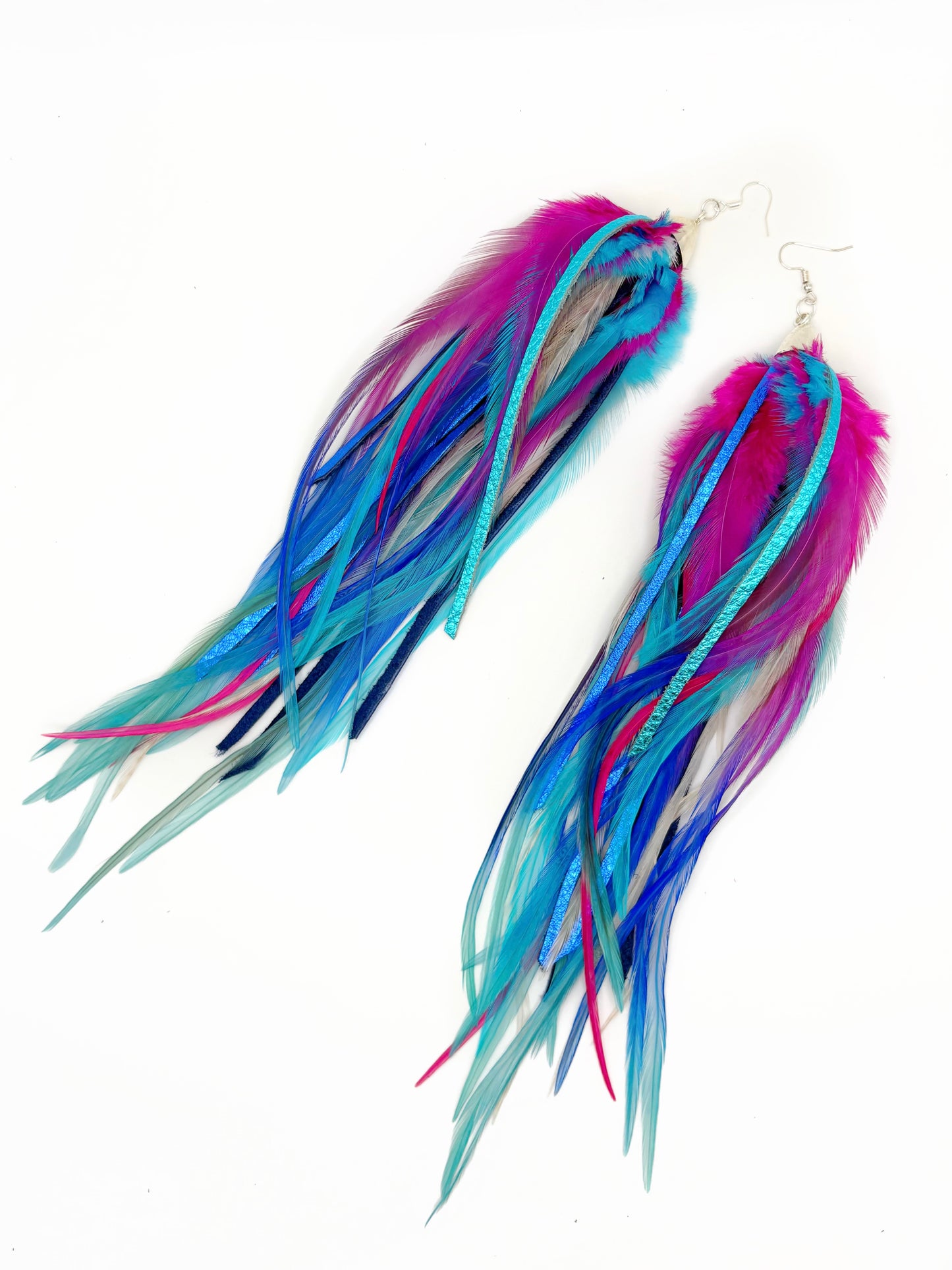 Long pink and blue feather and leather earrings.