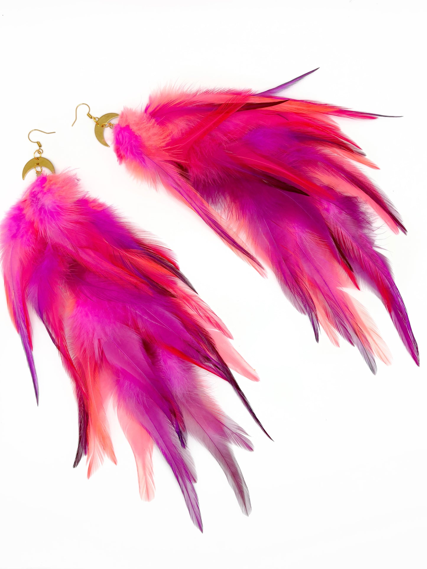 Long neon pink feather earrings.