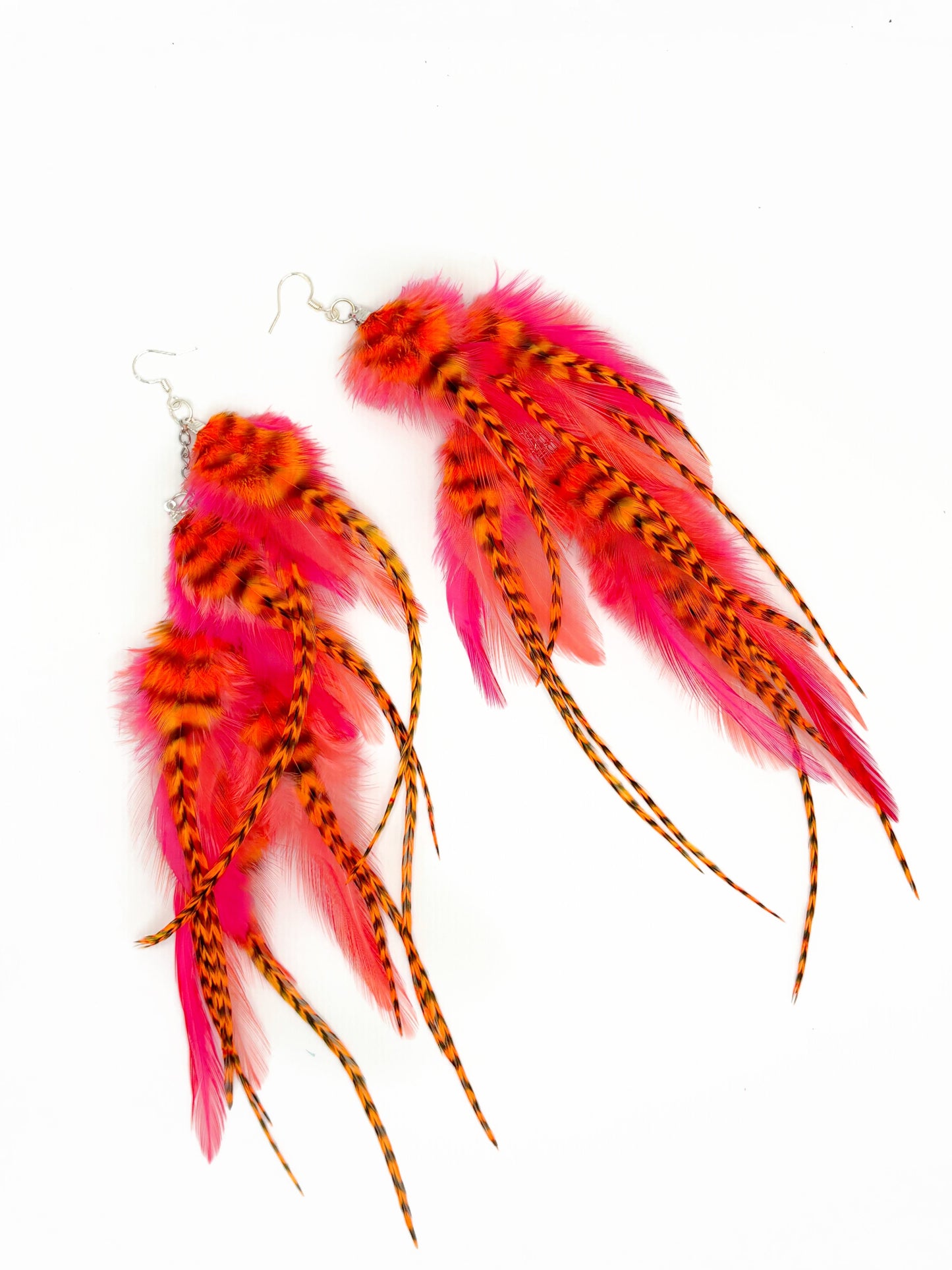 Neon pink and orange feather earrings.