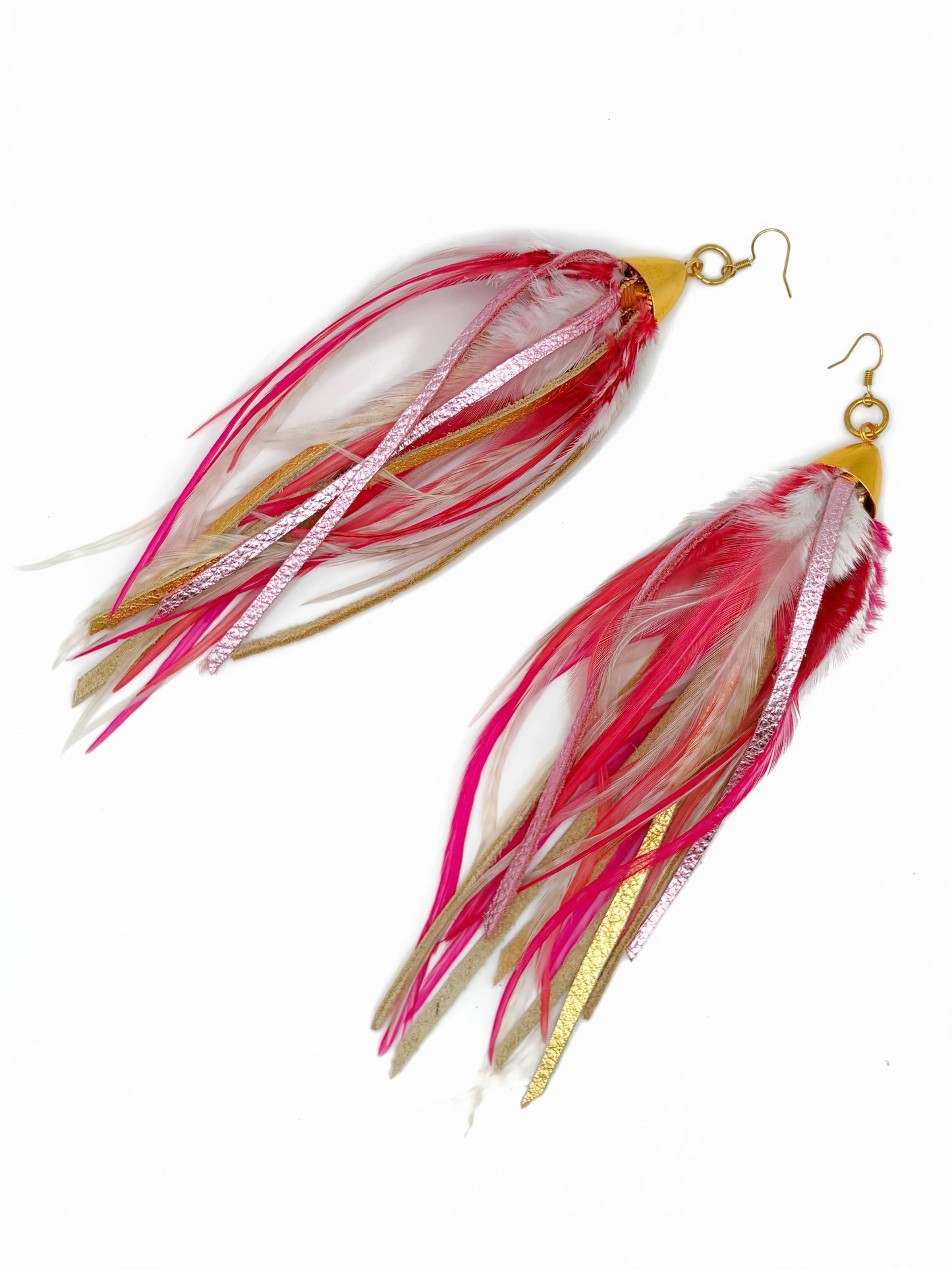 Pink and gold feather and leather earrings.