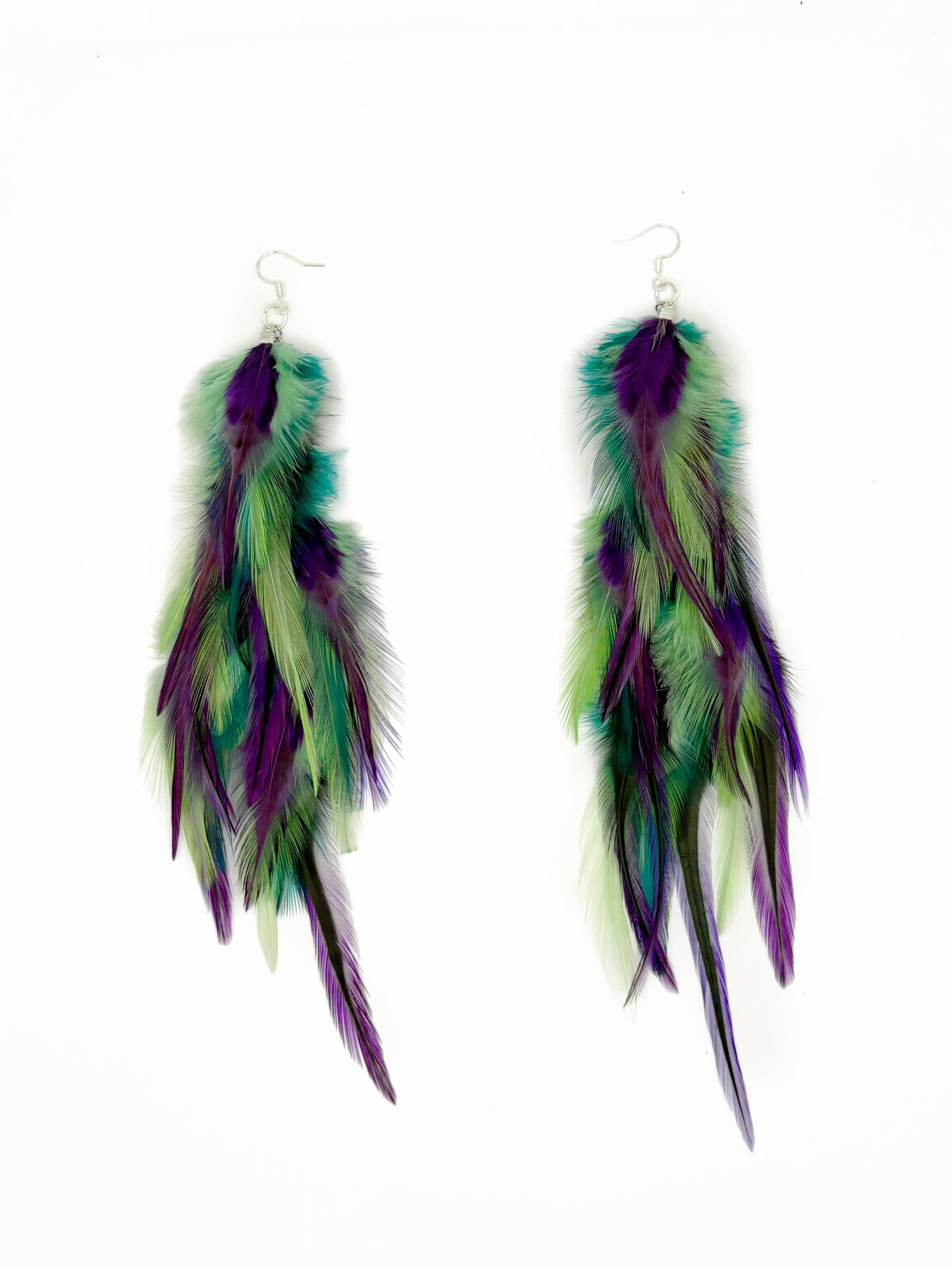 Long green and purple feather earrings.