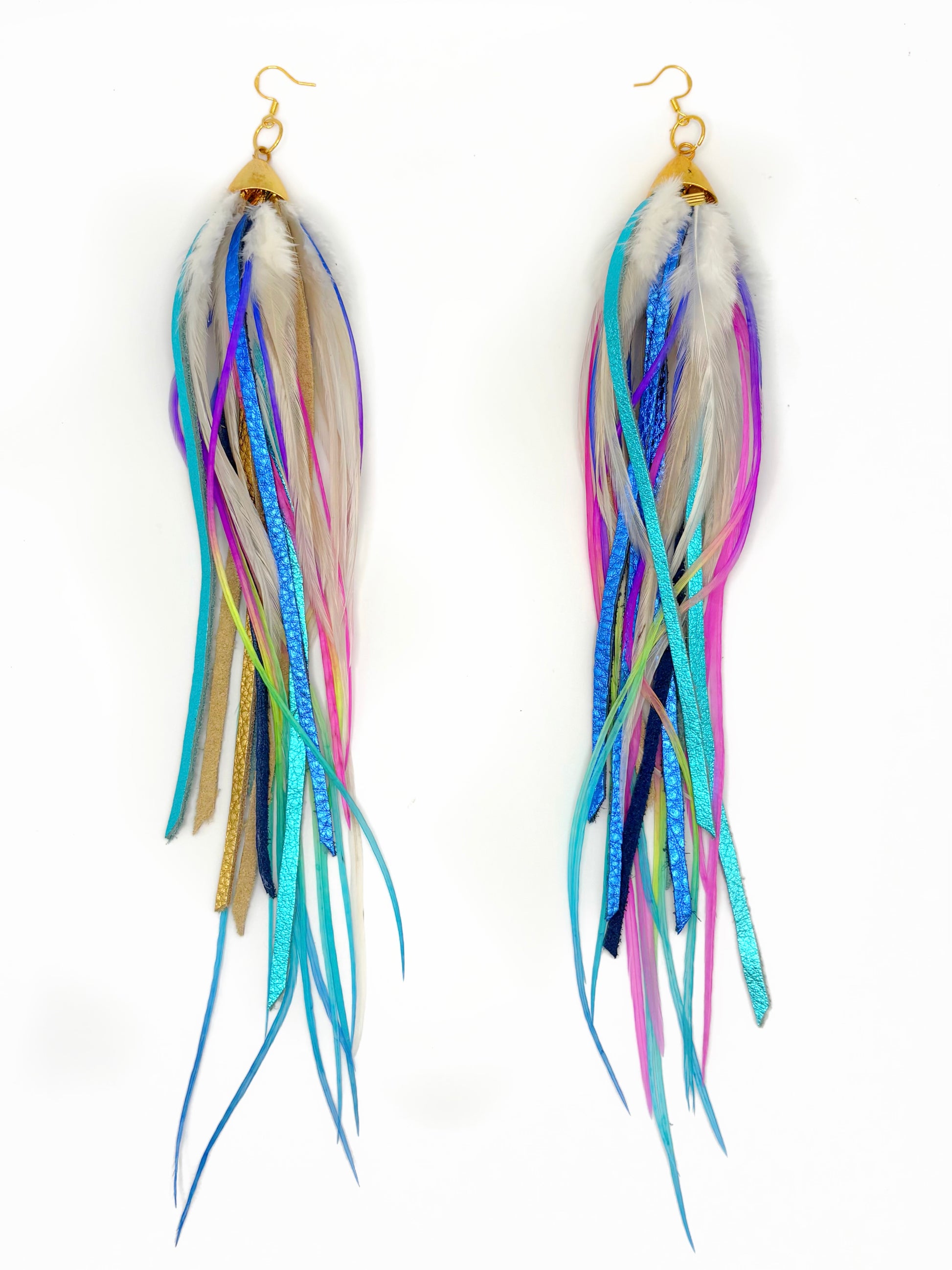 Multicolored feather-like earrings on a white background