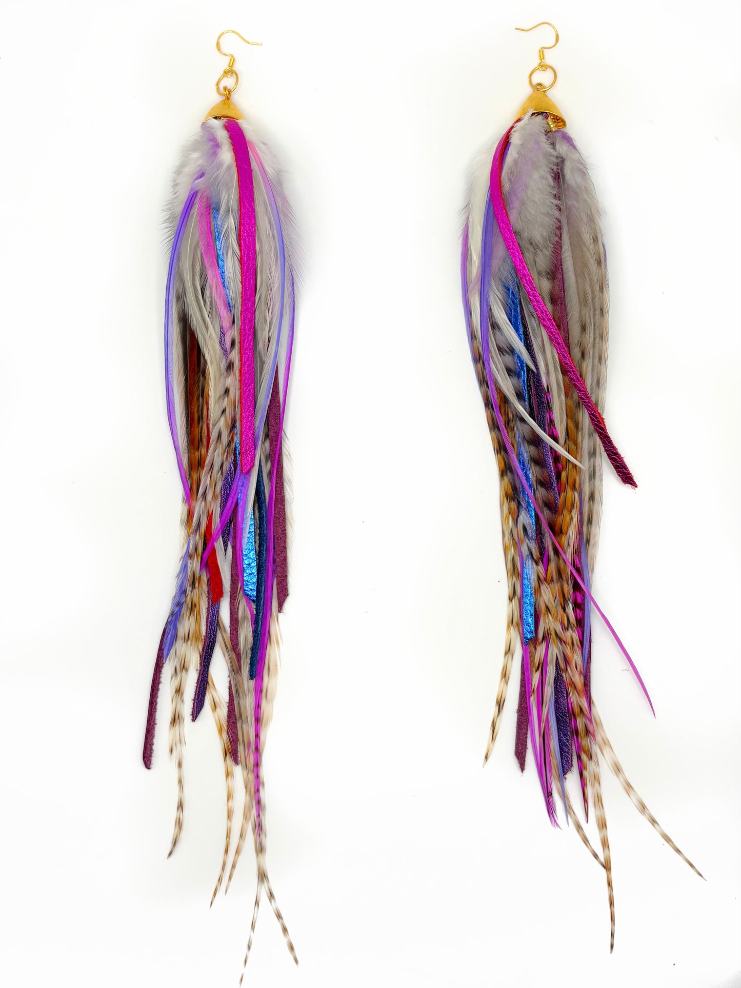 Multicolored feather earrings on a white background