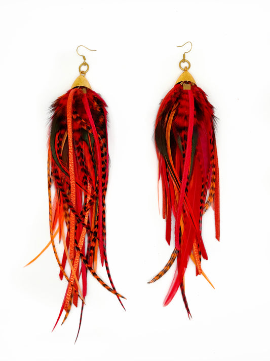 Long red feather earrings.