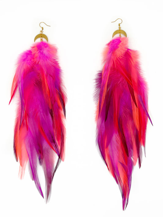Long neon pink feather earrings.