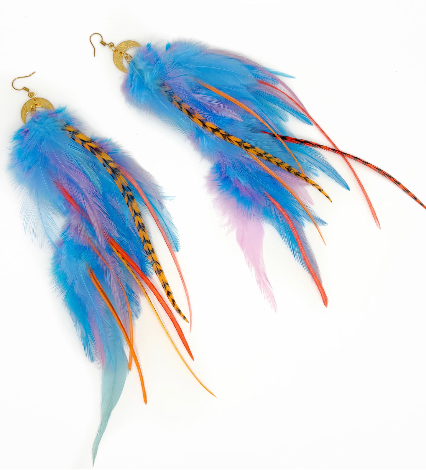 Colorful feather earrings on a white background