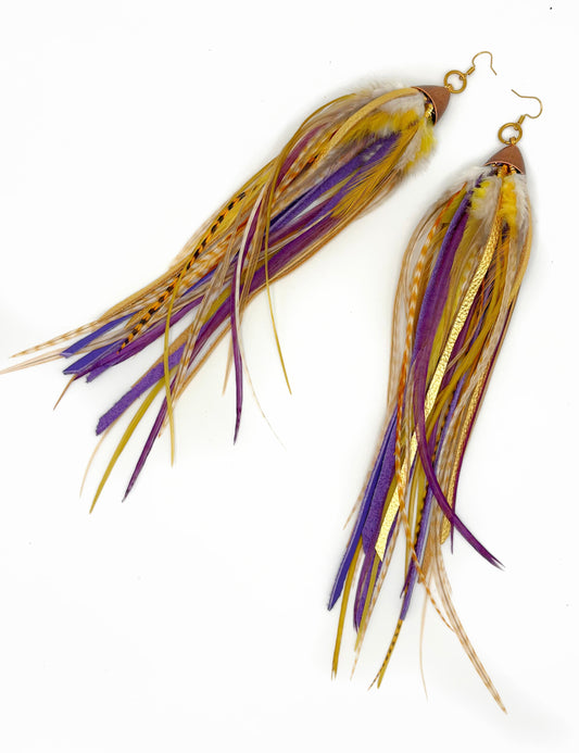 Gold and purple feather and leather earrings.