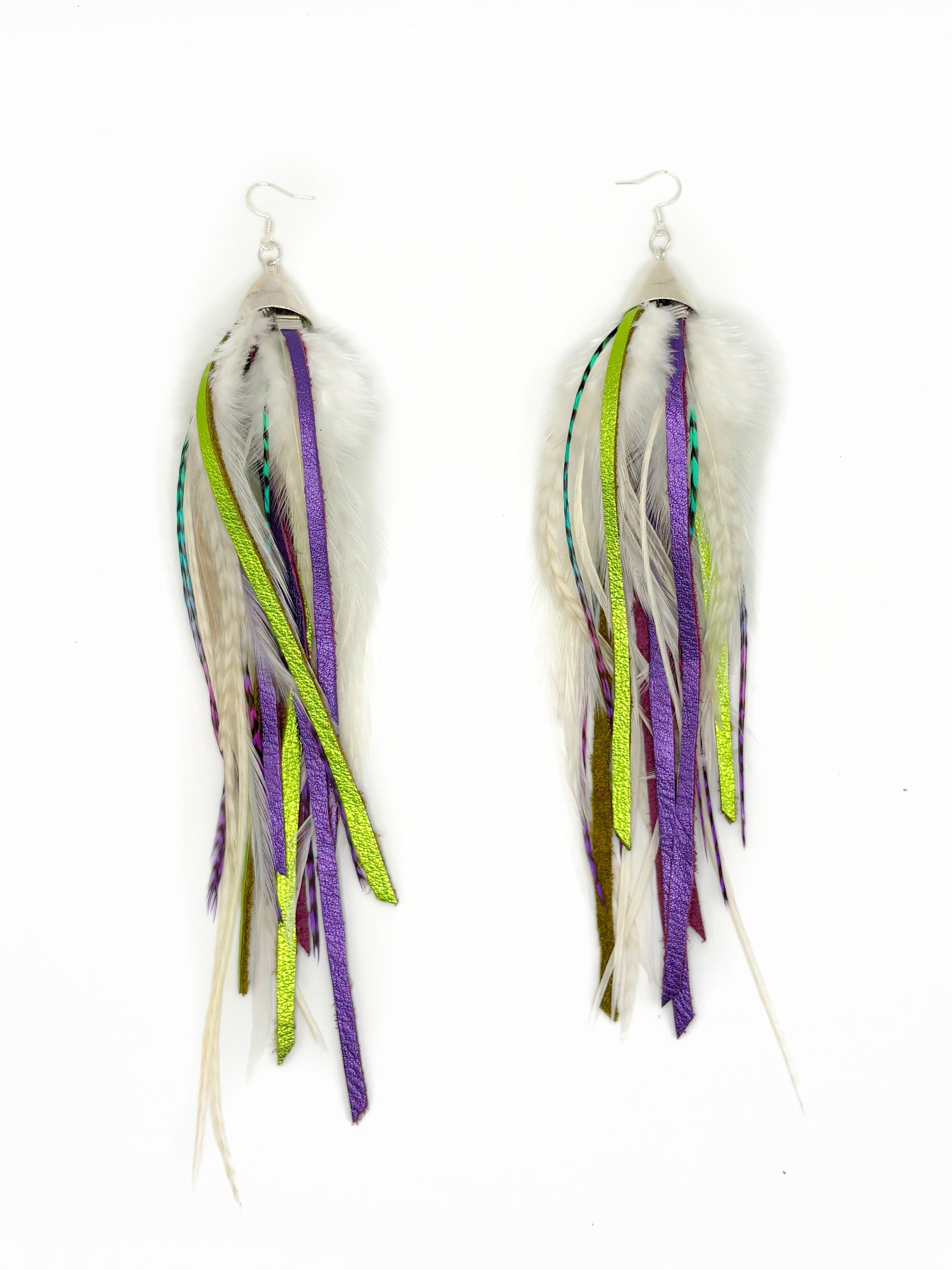 White feather earrings with green and purple leather. 
