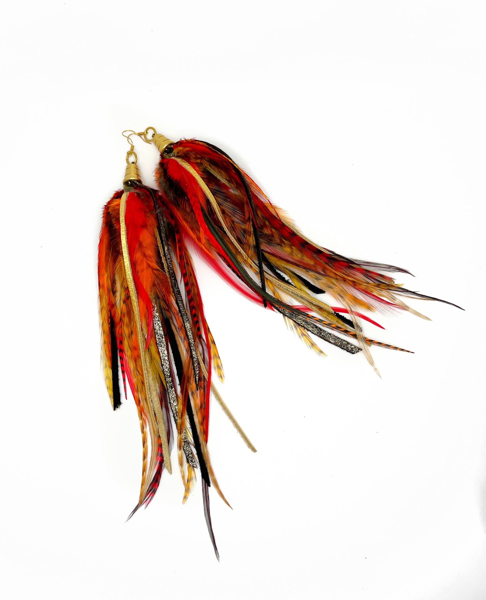 Long orange and red feather earrings with metallic gold and brown leather.