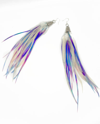Feathered earrings with multicolor strands on a white background