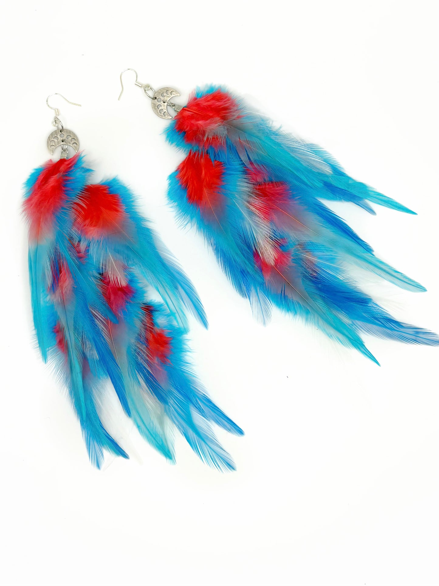 Blue and red feather earrings on a white background