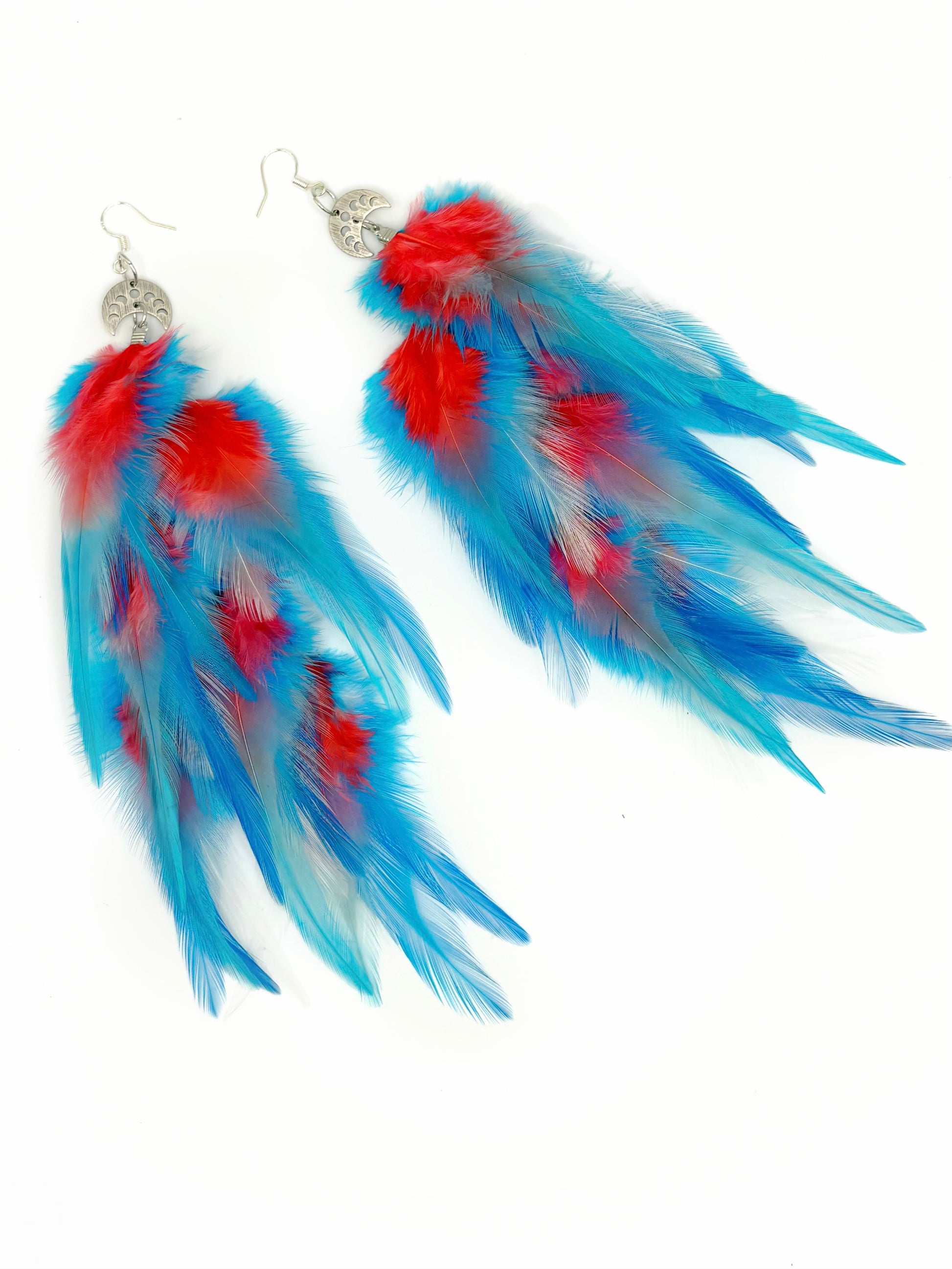 Blue and red feather earrings on a white background