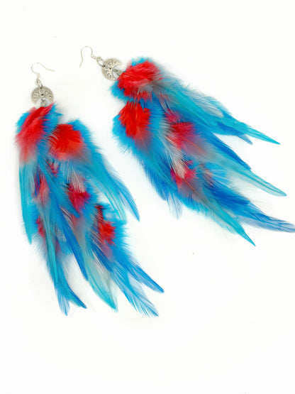 Blue and red feather earrings on a white background