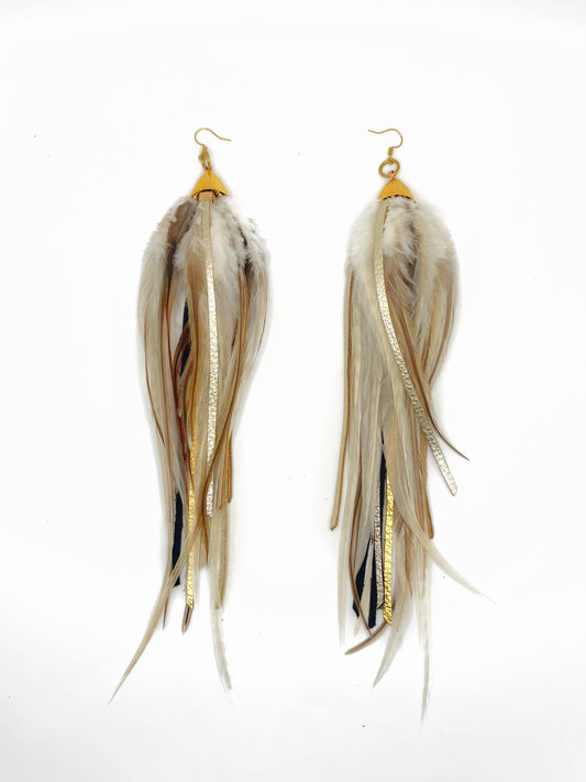 Long fluffy feather and leather earrings in natural tones. 