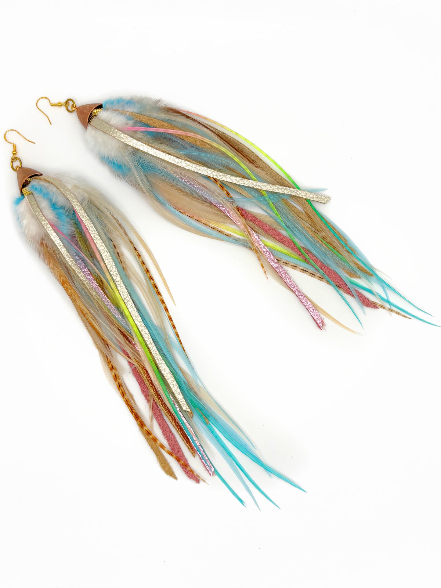 Multicolored feather earrings on a white background
