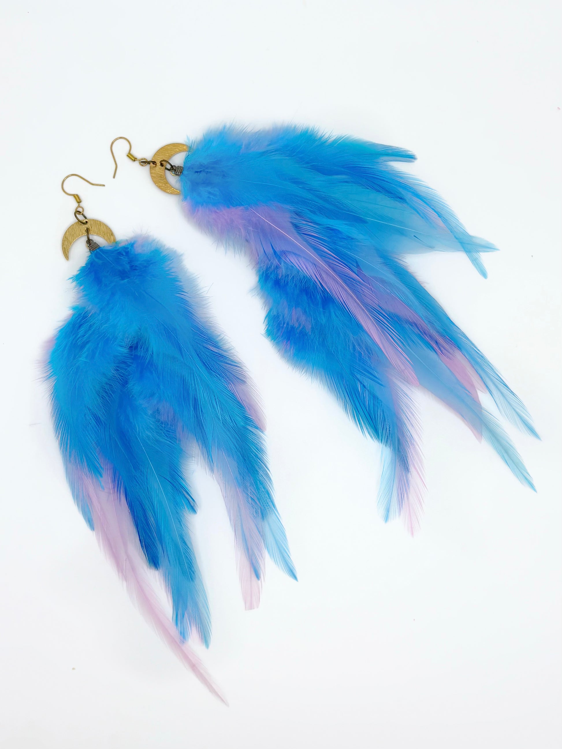 Long blue feather earrings. 