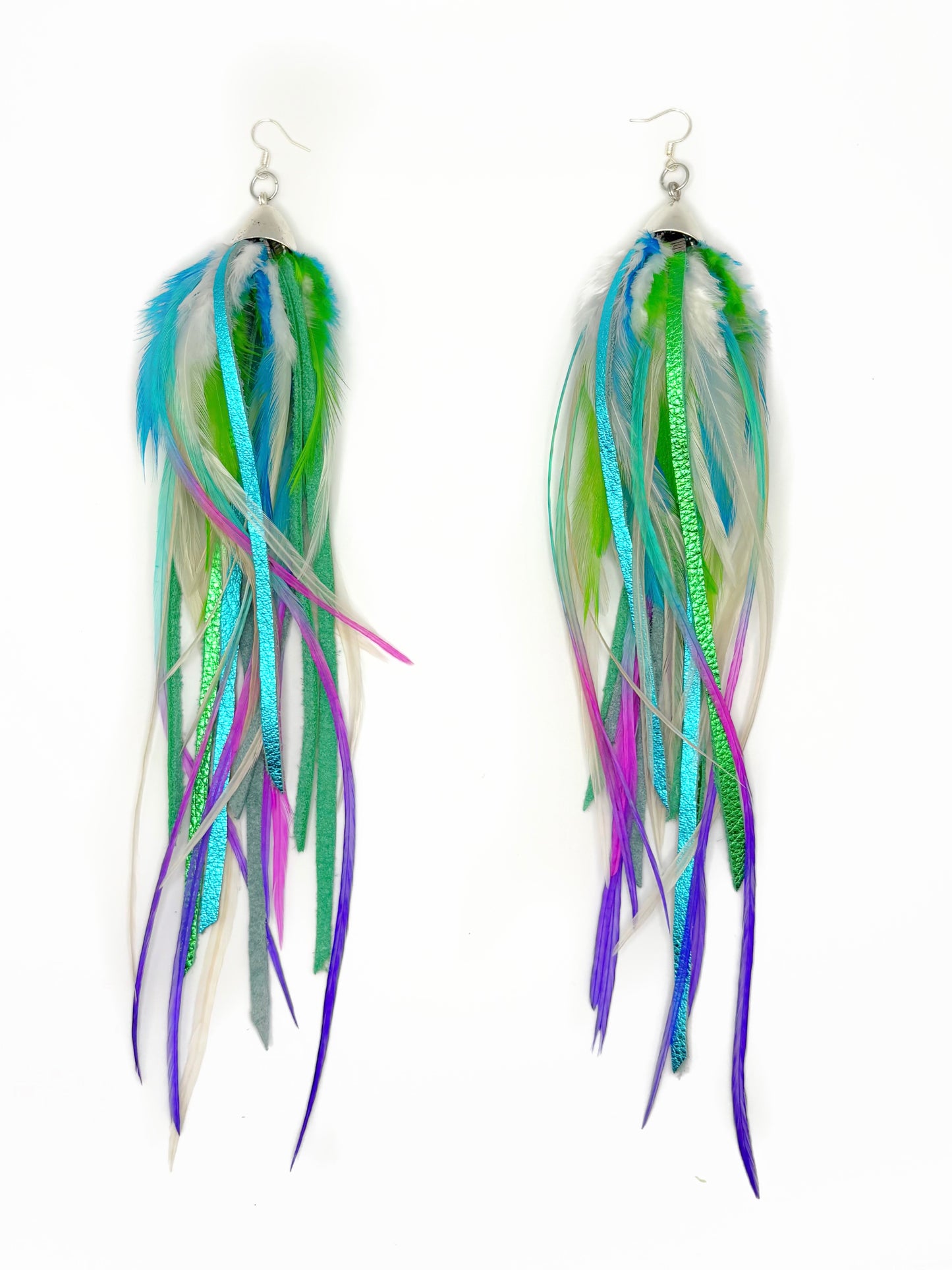 Multicolored feather earrings on a white background