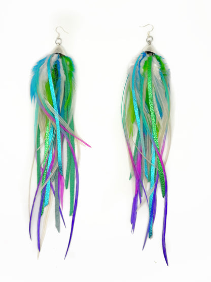Multicolored feather earrings on a white background