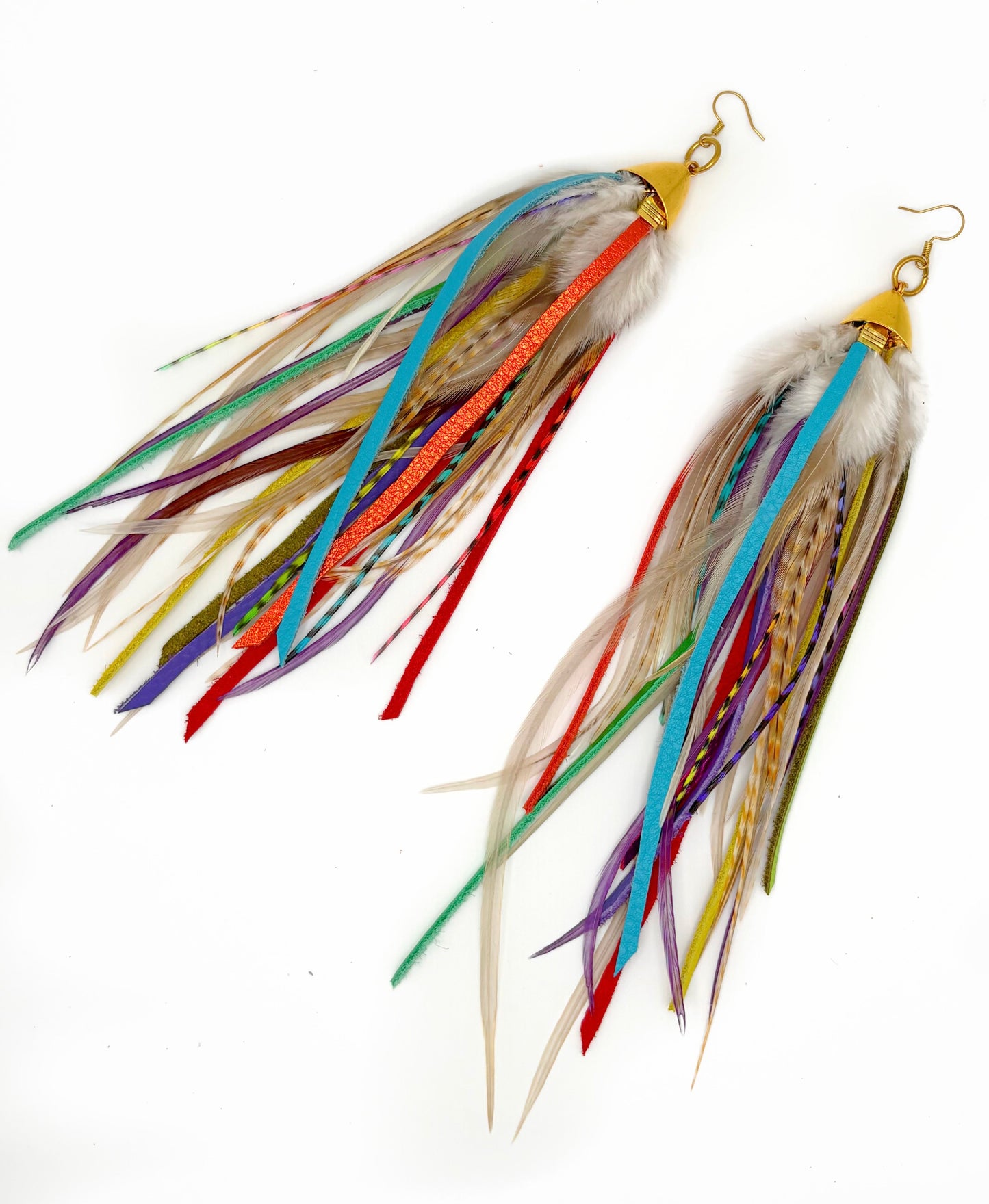 Colorful feather earrings on a white background