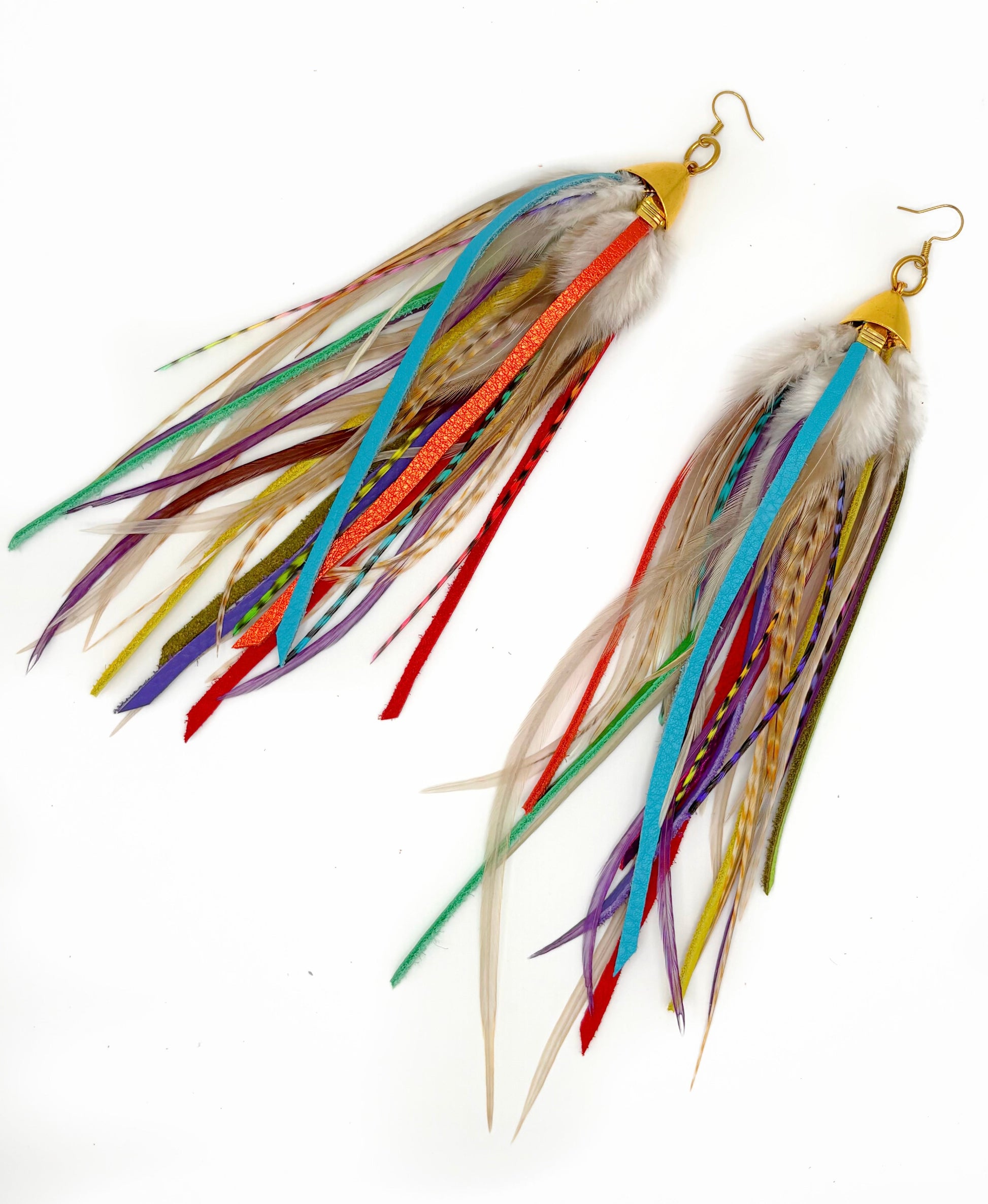 Colorful feather earrings on a white background