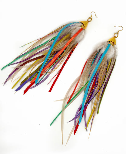 Colorful feather earrings on a white background