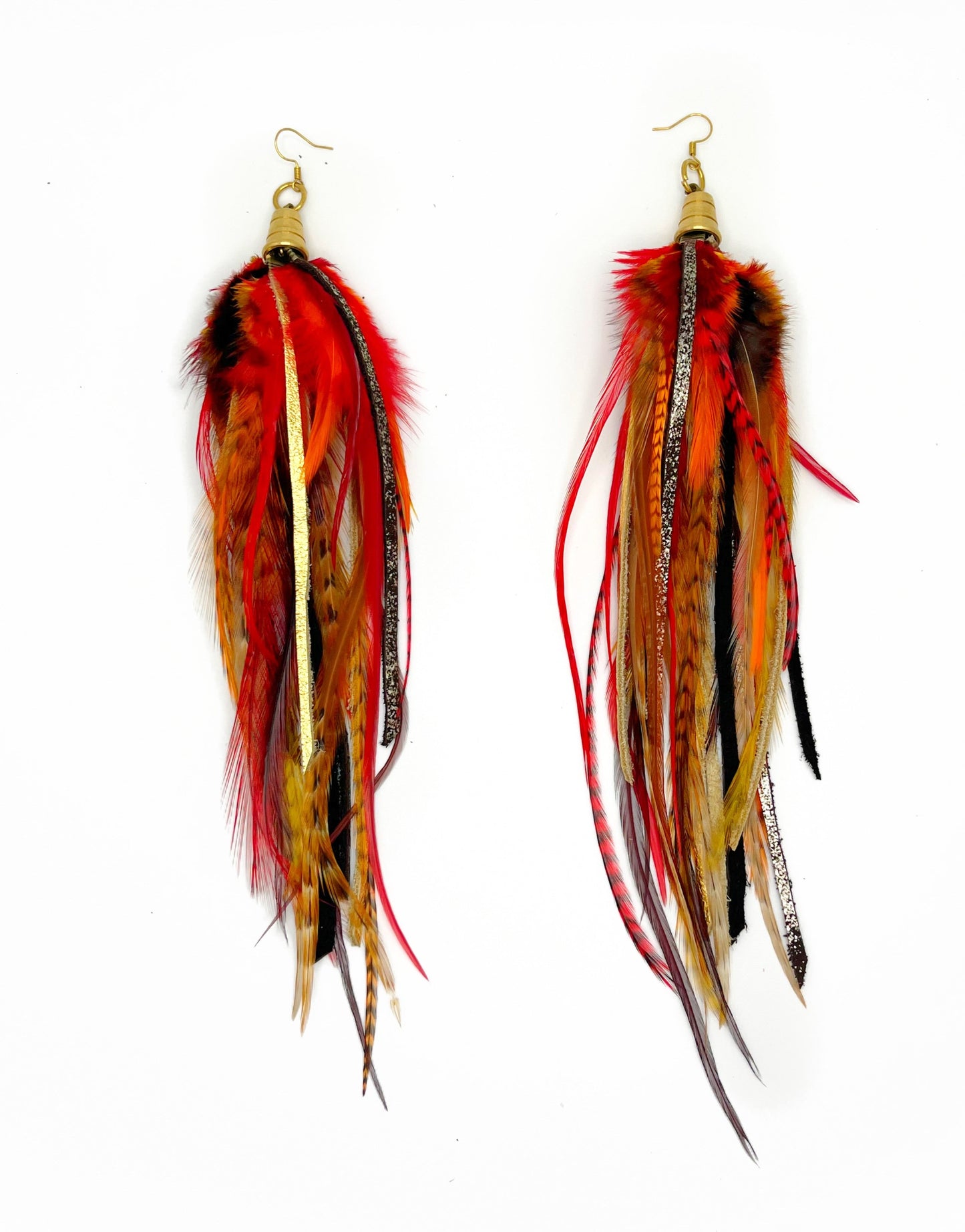 Long orange and red feather earrings with metallic gold and brown leather. 