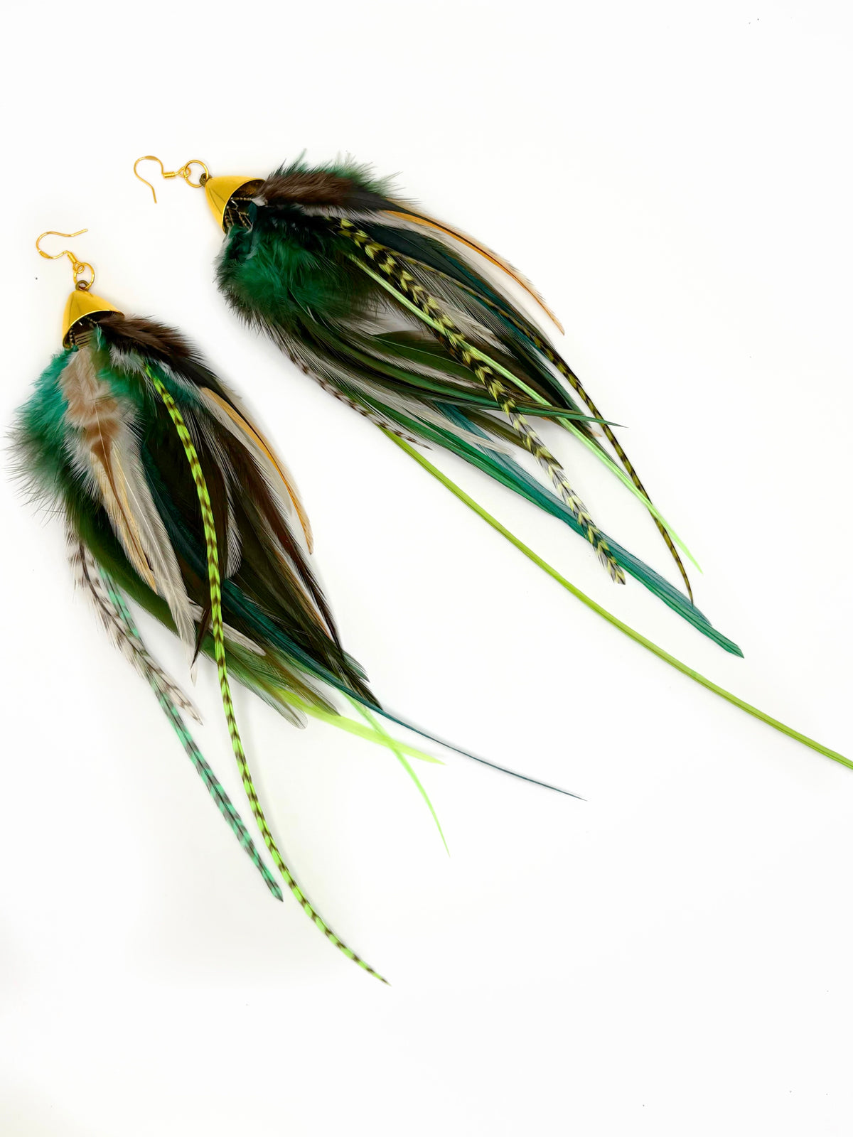 Long bohemian feather earrings featuring soft brown, beige and green rooster feathers cascading from gold cap pendants, handmade in Brooklyn.