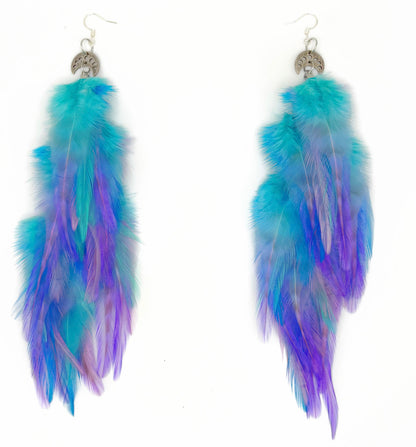 Turquoise and purple feather earrings on a white background