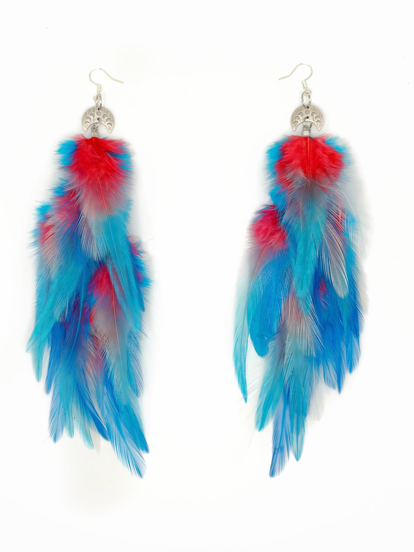 Pair of feather earrings with blue and pink feathers on a white background