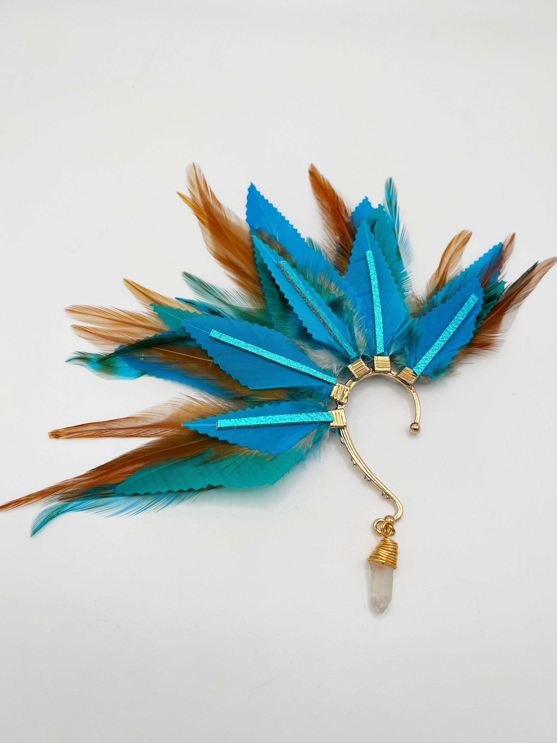 Turquoise blue and light brown feather ear cuff with blue leather accents and wire wrapped quartz dangle.