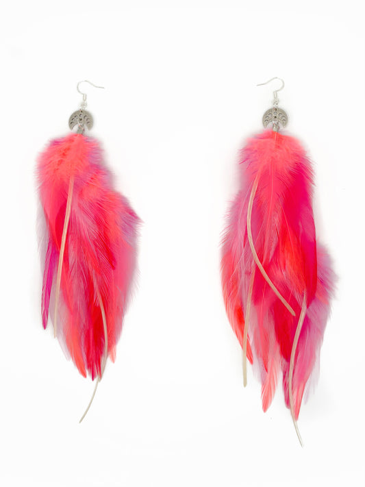 Neon pink feather earrings.