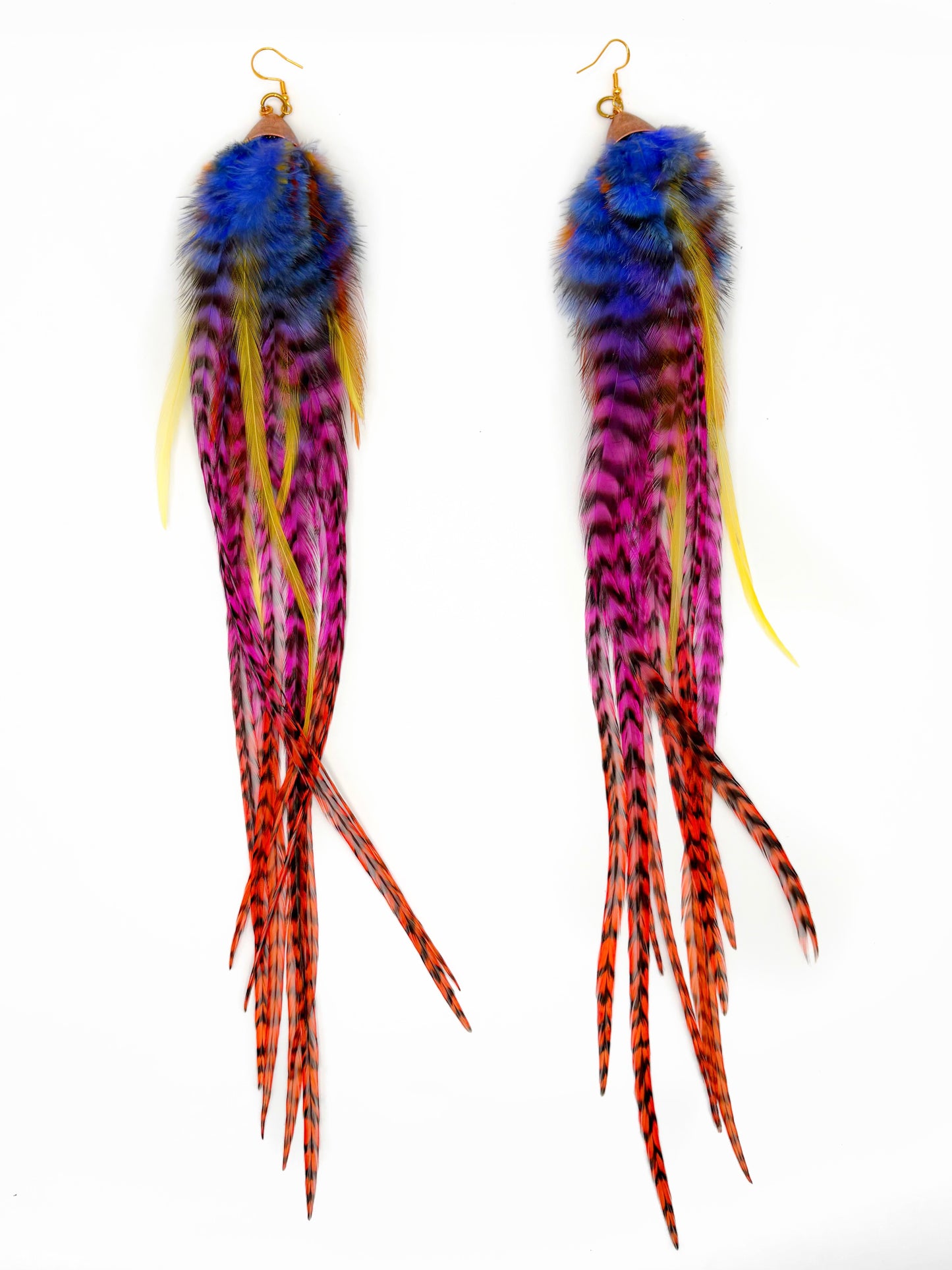 Colorful feather earrings on a white background